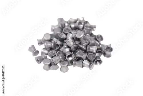 Pile lead pellets for an air rifle isolated on white