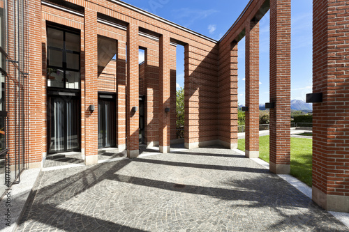 modern bricks house, patio with columns