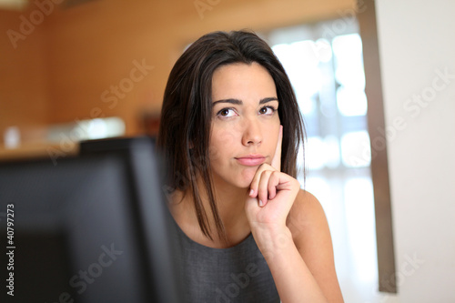 Office worker with interrogative look on her face