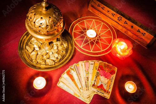 Tarot cards illuminated by candlelight.