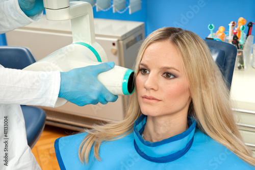 patient taking dental x-ray