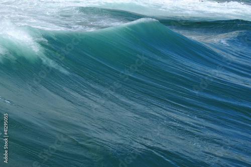 behind a wave
