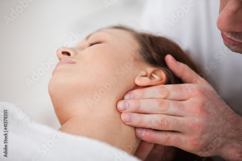 Close-up of woman being massaging by a physiotherapist