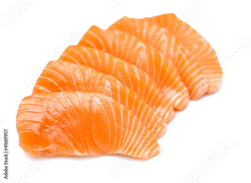 Isolated raw sliced salmon