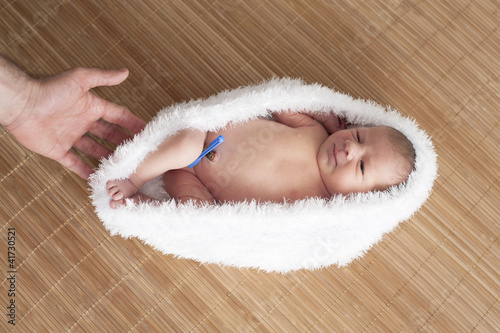 baby in white cocoon