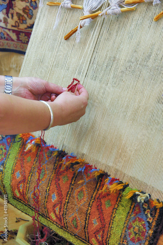 The woman behind work - weaving a carpet of silk