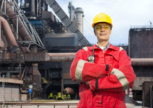 Factory worker in overalls