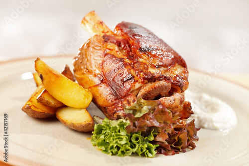 roasted pork knuckle with potatoes