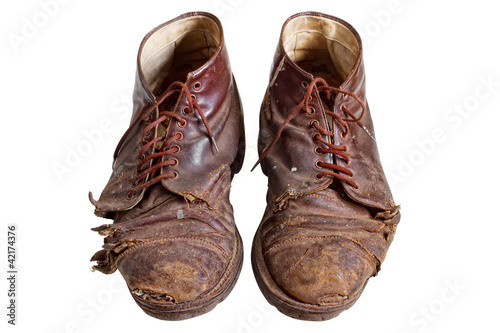 Old worn out boots, isolated on white