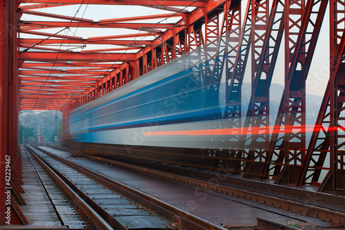 Abstract composition of moving train on the old railway bridge