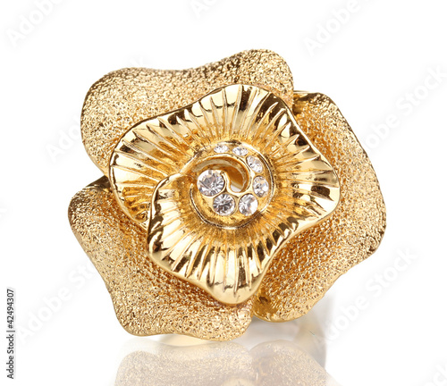 Golden ring with gold flower and clear crystals isolated