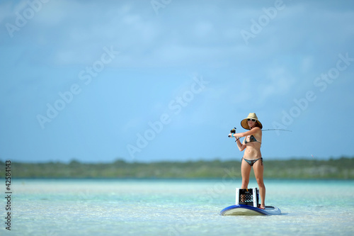 Fishing and paddleboarding in tropical destination