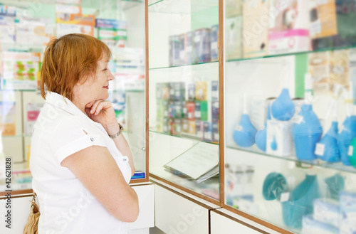 Mature woman r in pharmacy