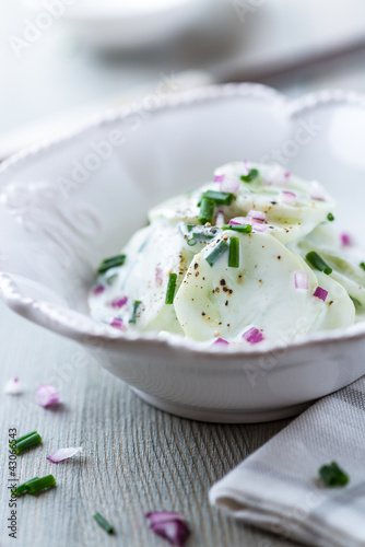 Cucumber with yogurt, chive and onion