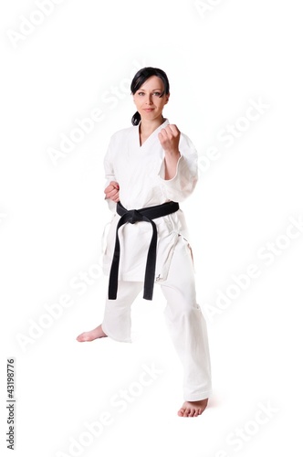 Karate woman posing on a white background