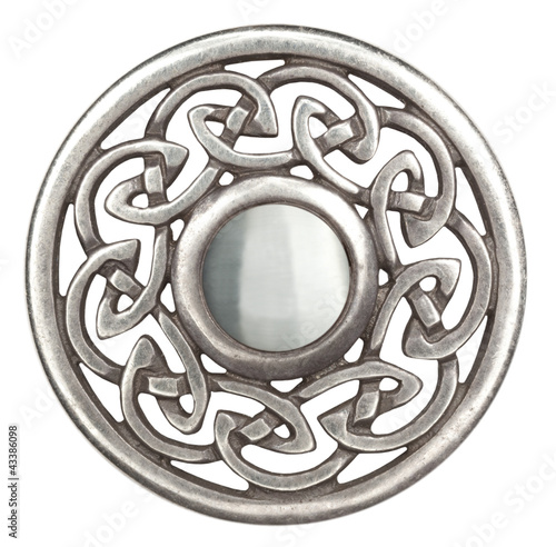 Silver celtic brooch in isolated on white Super macro