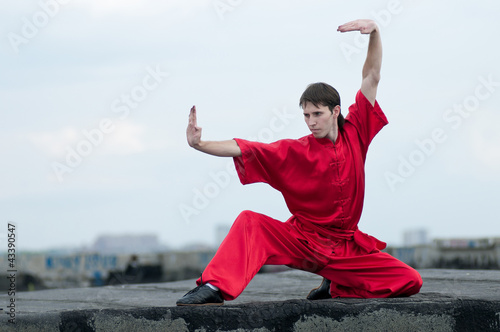 Wushoo man in red practice martial art