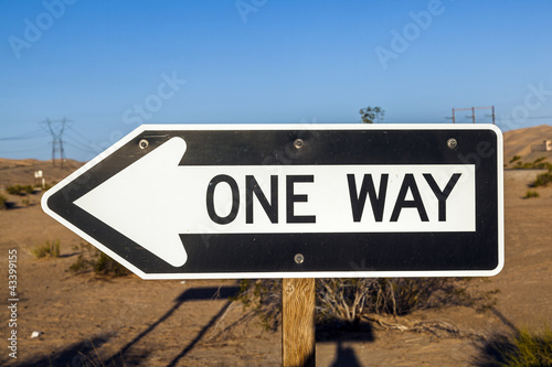 one way street Sign at the highway with blue sky