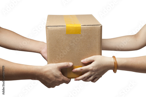 Close-up of the hands of two people holding a box