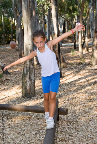 Girl walking on the balance beam