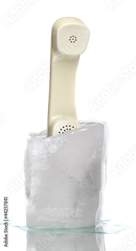 ice with old telephone on white background