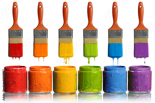 Paintbrushes Dripping into Paint Containers