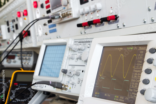 digital and analog oscilloscope in the foreground