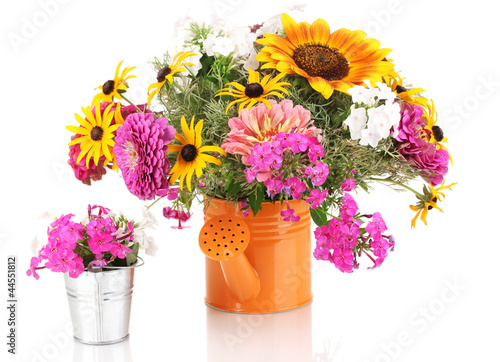 Beautiful bouquet of bright flowers in bailer isolated on white