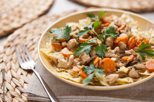 Chicken with noodles and carrots