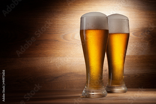 Beer into glass on a old stone