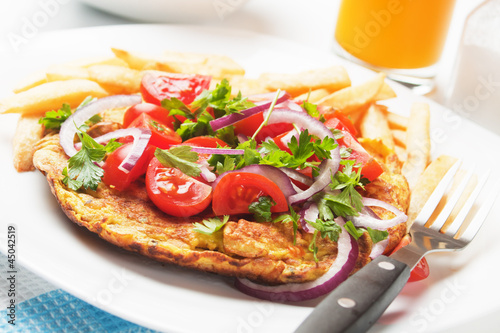 Omelet with tomato salad