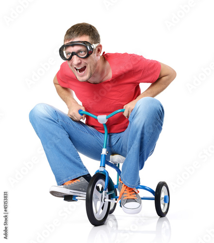 The curious man on a children's bicycle, on white background