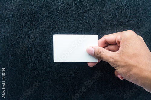 Hand holding card with empty space.