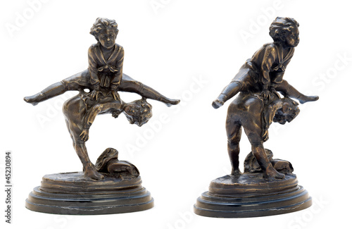 Antique bronze figurine with boys playing leapfrog.