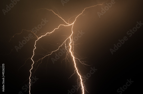 Spetacular orange lightning strike in the night