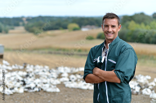 Duck breeder standing outside the farm