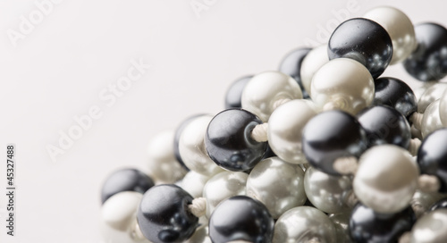 String of black and white pearls