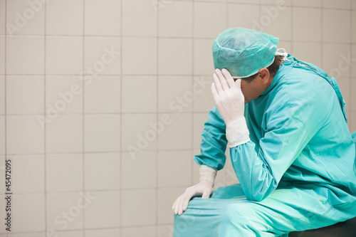 Thoughtful surgeon in a hospital