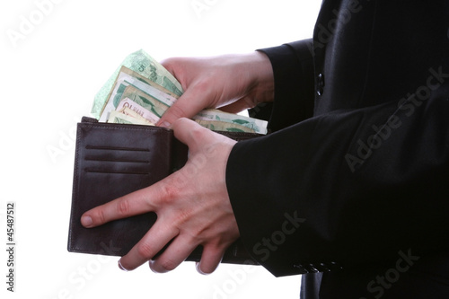 Businessman well-dressed looking for money in the wallet