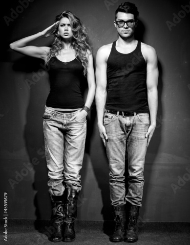 Sexy man and woman dressed casual posing - retro mood