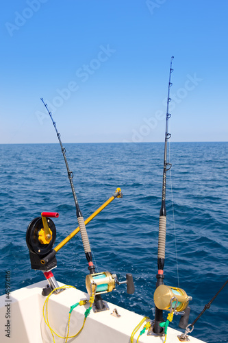 boat trolling fishing gear downrigger and two rods