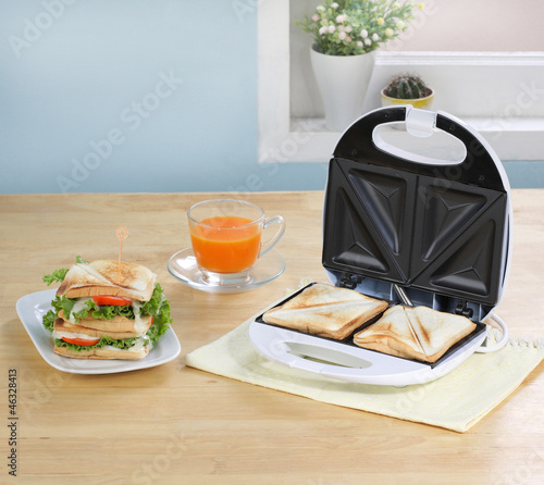 Sandwiches maker machine in the kitchen