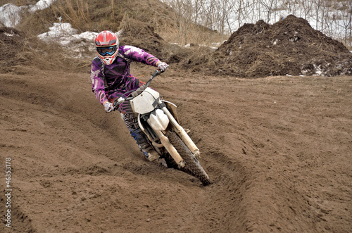 Motocross party rides standing cornering the furrow