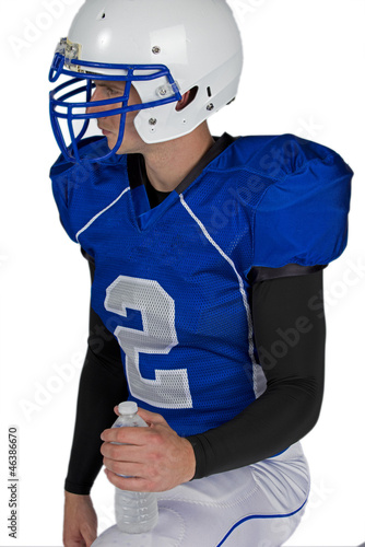 Isolated on a white, an American football player