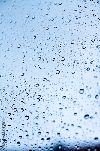 Raindrops on blue glass
