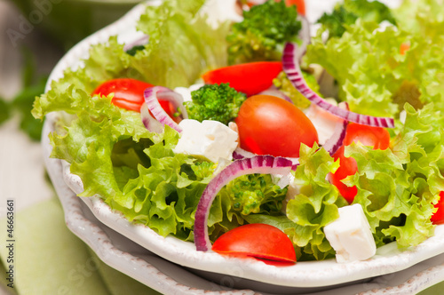 salad with tomatoes, broccoli, red onion and feta cheese