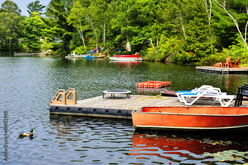 Cottage lake with diving platform and docks