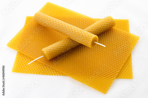 two Candle made of beeswax on honeycomb - background