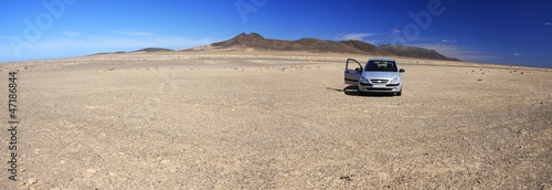 Rocky desert and car
