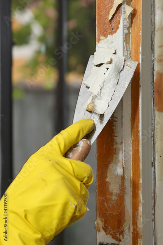 Old window restoration, remove paint with scraper